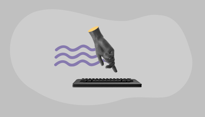 Uma mão e um teclado.