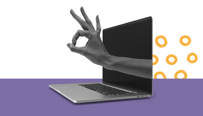 Uma mão fazendo o gesto de peteleco sai de um notebook, representando o bounce rate.
