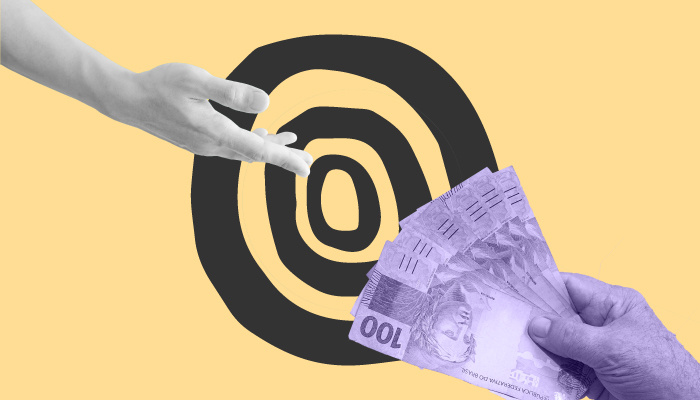 Uma mão indo em direção a outra mão que segura notas de 100 reais.