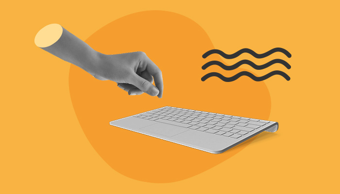 Imagem abstrata: uma mão flutua em direção a um teclado.